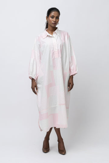 Designed for ease and defined by fabric, the Stripe Kaftan Shirt is crafted in 100% pure cotton for breathable comfort and quiet elegance. The relaxed, fluid silhouette features a dropped-shoulder construction that allows natural movement with an effortless drape.

